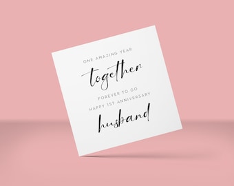 May include: A white card with black text that reads "One amazing year together. Forever to go. Happy 1st Anniversary Husband."