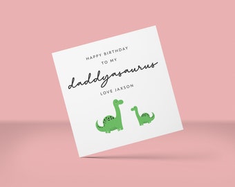 May include: A white card with the text "Happy Birthday to my daddyasaurus Love Jaxson" and two green dinosaur illustrations.