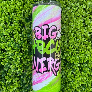 May include: A green and pink stainless steel tumbler with a black background and the words "Big HBCU Energy" in pink and white letters. The tumbler has a swirl design.