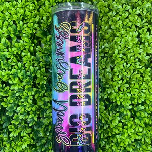 May include: A stainless steel tumbler with a colorful design and the words "Small Business Big Dreams" in a vertical layout. The design features a mix of blues, pinks, purples, and yellows with a leopard print accent.