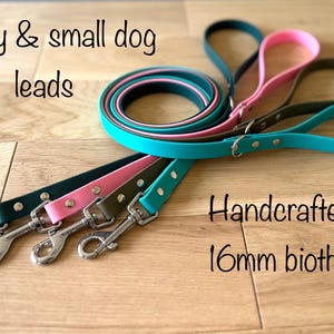 May include: Colorful puppy and small dog leads in teal, pink, and olive green. The leads are handcrafted from 16mm biothane and feature silver-colored metal clasps. The text "Puppy & small dog leads" and "Handcrafted in 16mm biothane" are visible.