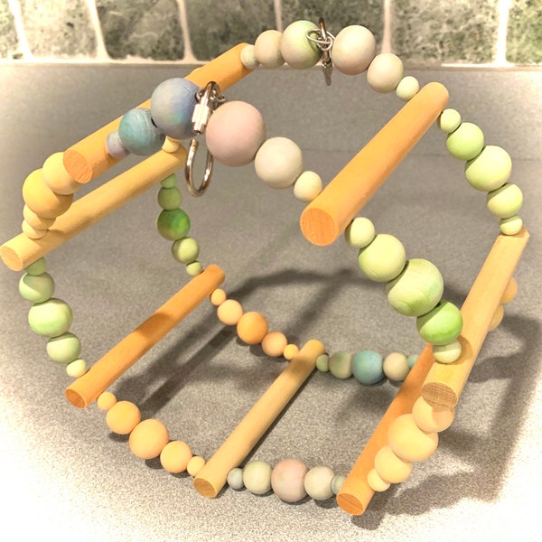 ROUND & ROUND SWING: Fun circular swing to climb. Wooden beads spin as your pet plays. Perfect for small and medium birds.