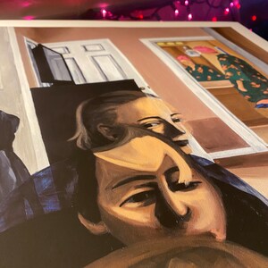 May include: A painting of two people, one lying down and the other sitting up. The person lying down has a mask over their face. The person sitting up has their back to the viewer. The painting is done in a realistic style with muted colors.