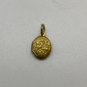 tiny deadstock vintage 1960&#39;s brass locket with floral design