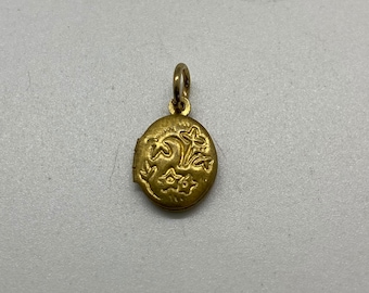 tiny deadstock vintage 1960's brass locket with floral design