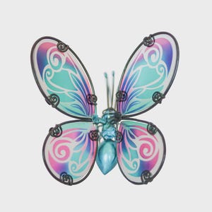 May include: A decorative butterfly with iridescent wings. The wings display a gradient of pink, blue, and teal with swirling patterns. The butterfly has a metallic body and antenna, and the wing edges are outlined in black.
