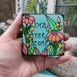 May include: A set of three ceramic nesting bowls in shades of blue, green, and white. The bowls feature a speckled glaze and a simple, modern design. The largest bowl is approximately 6 inches in diameter.