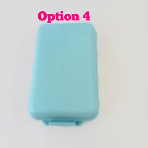 May include: A light blue rectangular plastic storage container with rounded corners and a smooth lid. The text Option 4 is printed in pink above the container. The object is shown from a top-down perspective against a plain white background.