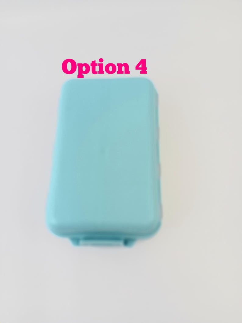 May include: A light blue rectangular plastic storage container with rounded corners and a smooth lid. The text Option 4 is printed in pink above the container. The object is shown from a top-down perspective against a plain white background.