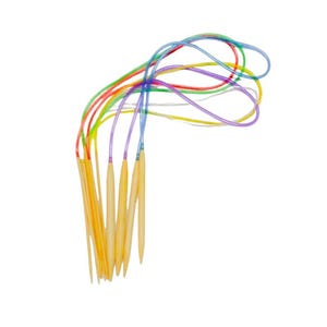 May include: A set of circular knitting needles featuring light tan, smooth wooden needle tips connected to flexible, translucent plastic cables in various bright colors including red, orange, yellow, green, blue, and purple, arranged in a bundle.