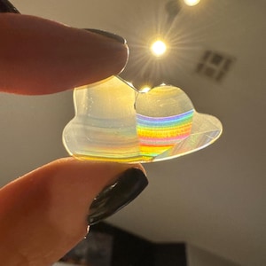 May include: A rustic wooden sign with the text "Welcome to our home" in white lettering. The sign features a distressed finish and a simple, inviting design, perfect for entryway decor.