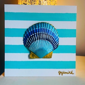 May include: A square canvas featuring horizontal white and turquoise stripes with a centered, three-dimensional seashell painted in shades of blue, white, and gold. The bottom right corner displays the gold handwritten signature text gysmith.