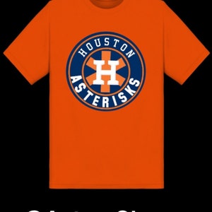 May include: Orange t-shirt with a blue and white Houston Astros logo featuring the text "Houston Asterisks" and a large "H" in the center.