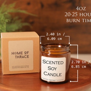 May include: A scented soy candle in a clear glass jar, 2.70 inches (6.85 cm) tall and 2.40 inches (6.09 cm) wide, with a burn time of 20-25 hours. The candle is in a brown box with the text "HOME OF THRACE".