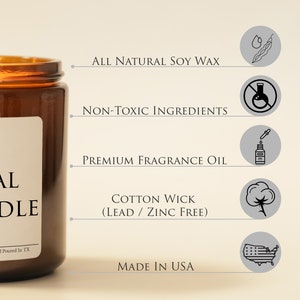 May include: A lit brown glass jar candle with a white label that reads "ALL NATURAL CANDLE". The candle features "ALL NATURAL SOY WAX", "NON-TOXIC INGREDIENTS", "PREMIUM FRAGRANCE OIL", and "COTTON WICK (LEAD / ZINC FREE)". The candle is made in the USA.