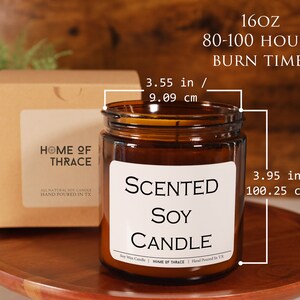 May include: A brown glass candle jar with a white label that reads "Scented Soy Candle" and "Home of Thrace". The candle is 10cm tall and 9cm wide. The candle is packaged in a brown box with a window that shows the candle.