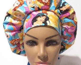 May include: A colorful bouffant scrub cap featuring a repeating pattern of various princess characters. The cap has a blue, pink, and yellow color scheme. The cap is designed to be worn in a medical or professional setting.