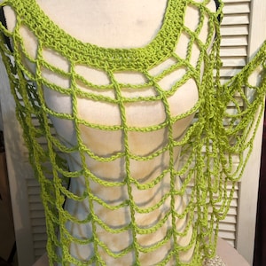 May include: A lime green crochet top with a web-like design. The top is sleeveless and has a wide neckline.