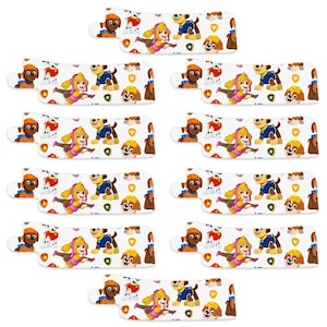 May include: Ten white and blue Paw Patrol themed party favour cups with images of the characters Chase, Marshall, Skye, Rubble, and Rocky. The cups feature a white background with blue accents and the Paw Patrol logo.