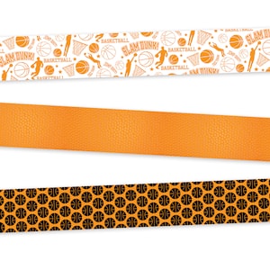 May include: Three different basketball themed borders. The top border is white with orange basketballs, hoops, and players. The middle border is orange with a basketball texture. The bottom border is orange with black basketballs.