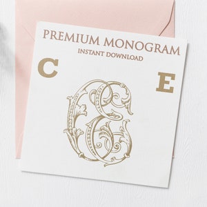 May include: A white card with the text "PREMIUM MONOGRAM INSTANT DOWNLOAD" and the letters "C" and "E" in gold. The letters are surrounded by a decorative floral design.