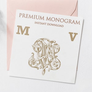 May include: A white card with the text "PREMIUM MONOGRAM INSTANT DOWNLOAD" and the letters "M" and "V" in gold. A gold ornate monogram design of the letters "M" and "V" is in the center of the card.
