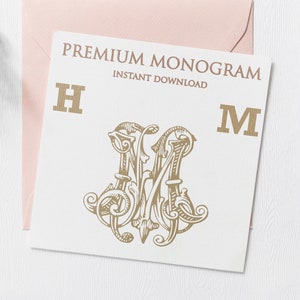 May include: A white card with the text "PREMIUM MONOGRAM INSTANT DOWNLOAD" and the letters "H" and "M" in gold. A gold monogram design with the letters "HM" is in the center of the card.