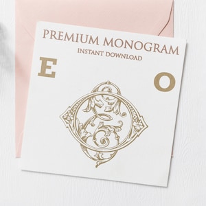 May include: A white card with the text "PREMIUM MONOGRAM INSTANT DOWNLOAD" in gold lettering. The letters "E" and "O" are also in gold lettering. A gold ornate design is between the letters.