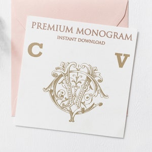 May include: A white card with the text "PREMIUM MONOGRAM INSTANT DOWNLOAD" in black lettering. The letters "C" and "V" are in gold, and a gold monogram design is in the center of the card.