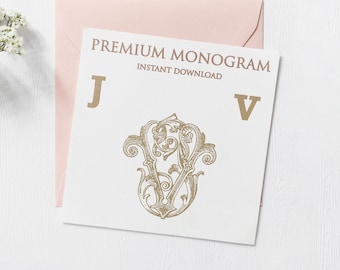 May include: A white card with the text "PREMIUM MONOGRAM INSTANT DOWNLOAD" and the letters "J" and "V" in gold. A gold monogram with the letters "V" and "J" intertwined is in the center of the card.