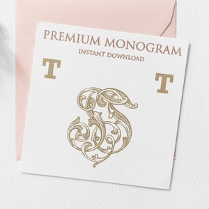 May include: A white card with the text "PREMIUM MONOGRAM INSTANT DOWNLOAD" in gold lettering. The card features a gold monogram of the letter "S" with ornate flourishes. The letters "T" are on either side of the monogram.