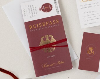 May include: A red passport-style wedding invitation with gold lettering. The front cover reads "Reisepass" and "Hochzeitseinladung". The back cover has the date "7.08.2021" and the names "Kerstin und Michael".