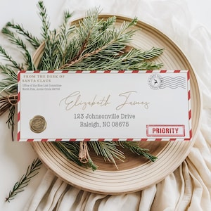Editable Santa letter envelope with red calligraphy and North Pole seal, perfect for moms creating a magical Christmas Eve surprise