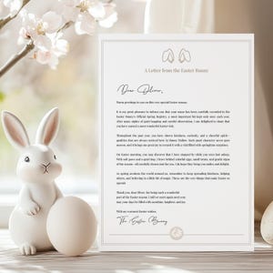 May include: A white ceramic Easter bunny figurine with an egg, and a letter from the Easter Bunny. The letter is addressed to Oliver and mentions colorful eggs and springtime surprises. The scene is set with spring blossoms.