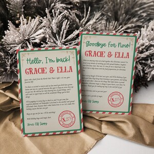 May include: Two Christmas-themed cards with text. One card reads "Hello, I'm back! Gracie & Ella" and the other says "Goodbye for now! Gracie & Ella." Both cards have a green border with red stripes and a stamp that says "Approved".