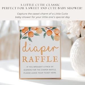K&ouml;nnte beinhalten: Ein goldfarbener Rahmen mit einer Aquarell-Illustration von Orangenbl&uuml;ten und dem Text "diaper raffle". Das Schild lautet: "Wenn Sie eine Packung Windeln f&uuml;r die Windeltombola mitgebracht haben, hinterlassen Sie bitte Ihr Ticket hier."