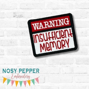 May include: An embroidered patch with the text "WARNING INSUFFICIENT MEMORY". The patch has a black border, red and white text, and is set against a white brick wall. The text "July 2025 mega Bundle" is above the patch.