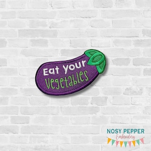 May include: Purple and green embroidered iron-on patch shaped like an eggplant with the text "Eat Your Vegetables" in white.