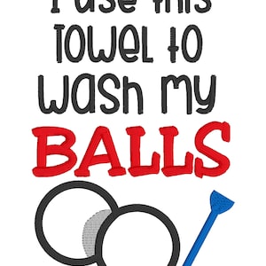 May include: White background with the text "I use this towel to wash my balls" in black and red. Below the text are two black circles and a blue golf tee.