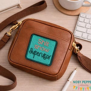 May include: A handmade, wooden serving tray with a natural finish. The tray features a rectangular shape with raised edges and integrated handles. The wood grain is visible, showcasing the tray's rustic charm. Dimensions are approximately 16 inches long, 10 inches wide, and 2 inches high.
