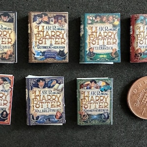 May include: A set of ten miniature hardback books featuring the covers of the Harry Potter series. The books are in various colours, including red, blue, green, and brown. The titles of the books are visible on the covers, including "Harry Potter and the Philosopher's Stone", "Harry Potter and the Chamber of Secrets", "Harry Potter and the Prisoner of Azkaban", "Harry Potter and the Goblet of Fire", "Harry Potter and the Order of the Phoenix", "Harry Potter and the Half-Blood Prince", and "Harry Potter and the Deathly Hallows".