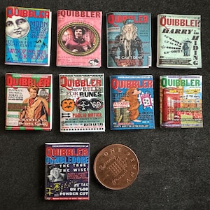 May include: A collection of ten miniature replica copies of the fictional newspaper, The Quibbler, from the Harry Potter series. The covers feature various illustrations and headlines, including "Moon Cheese", "New Rules for Runes", "Nifflers", and "Dumbledore the True the Wise!"