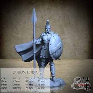 May include: A light gray figurine of a Spartan warrior, holding a spear and shield. The warrior wears a helmet, armor, and a cape. The figurine is on a small base. Measurements are provided: 32mm (1.26 in) high, 32mm (1.26 in) wide, and 27mm (1.06 in) deep.