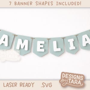 May include: A banner spelling "AMELIA" in white letters, strung on twine. The banner flags are a light blue-green color. The image includes the text "7 BANNER SHAPES INCLUDED!" and "LASER READY .SVG". The banner is from "DESIGNS by TARA".