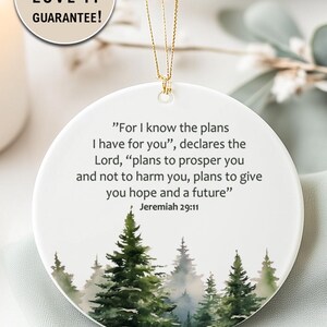 An aesthetic Christian Christmas ornament with bible verse from Jeremiah 29:11 "For I know the plans I have for you", featuring a watercolor pine trees design . Personalize it with name and date and it becomes a unique religious keepsake gift for a men and women. 

Our meticulously handprinted keepsake ornaments are crafted from premium quality ceramic using high quality ink. Will never fade. Scratch resistant. 100% satisfaction guarantee.