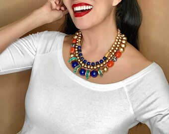 Opulent gold lapislazuli turquoise cloisonne intricate sophisticated ancient Egyptian artistry orange mystique statement chic blue elegant