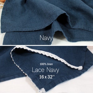 May include: A navy blue linen tea towel with white lace trim. The towel is 16 inches by 32 inches. 100% linen. Lace Navy.