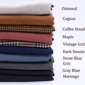 May include: A stack of folded fabric swatches in various colors and patterns, labeled as Oatmeal, Cognac, Coffee Houndstooth, Maple, Vintage Grid, Dark Denim, Stone Blue, Gris, Gray Blue, and Marengo, arranged vertically against a plain background.