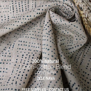 May include: Beige linen-cotton blend fabric with a dotted pattern in dark teal. The fabric is draped, showing its texture and the text "100% natural Linen-Cotton Blend".