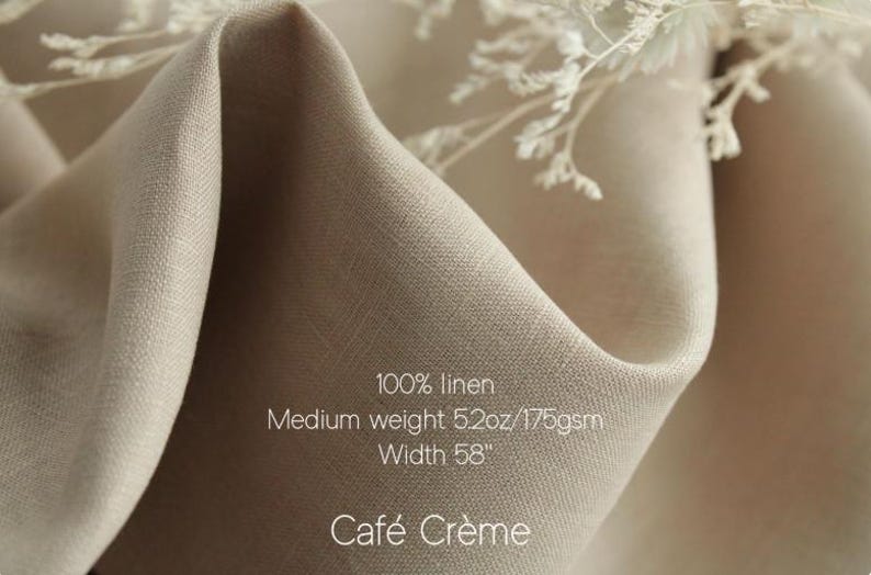 May include: A piece of light beige 100% linen fabric with a medium weight of 5.2oz/175gsm and a width of 58 inches. The fabric is draped in soft folds and features the text 100% linen, Medium weight 5.2oz/175gsm, Width 58, and Caf&eacute; Cr&egrave;me.